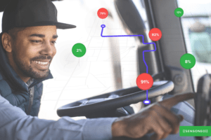 A driver of a truck who is setting our driver navigation app on his phone. 