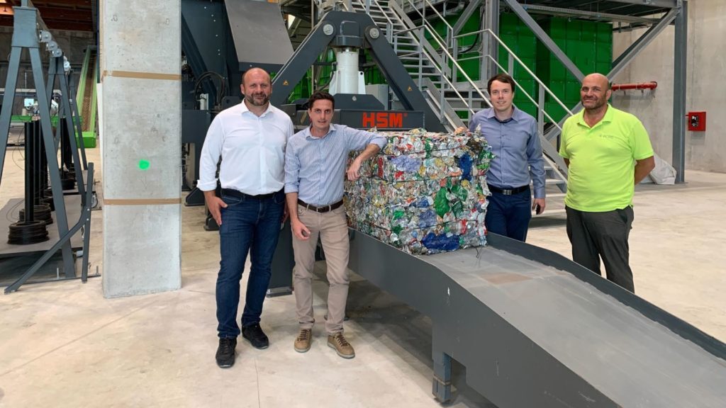 Martin Basila and Peter Knaz from Sensoneo and two employees of BCRS Malta in recycling center.