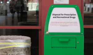 Green bin for drug disposal.