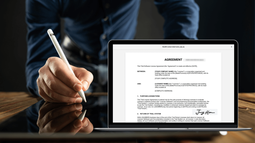 Mockup of digital agreement with the man signing the agreement digitally in the background. 