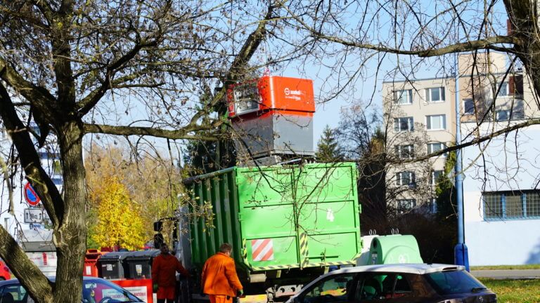 Garbage truck collecting Asekol bin for e-waste.