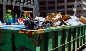 Large-capacity containers filled with different types of waste in a city.