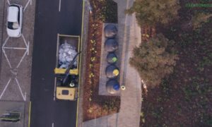 Waste pickup from semi-underground bins in the large city.